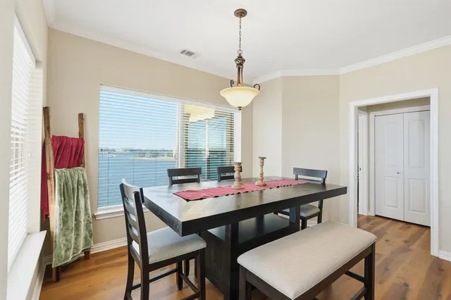 a view of a dining room with furniture window and wooden floor