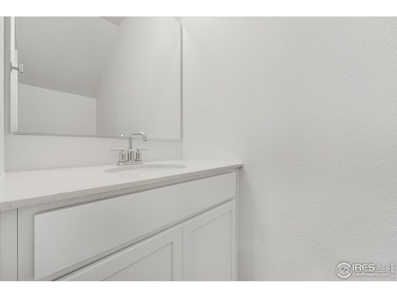 3912 Net Street Evans, CO 80620 - Photo 11 of 19 a bathroom with a sink and a mirror