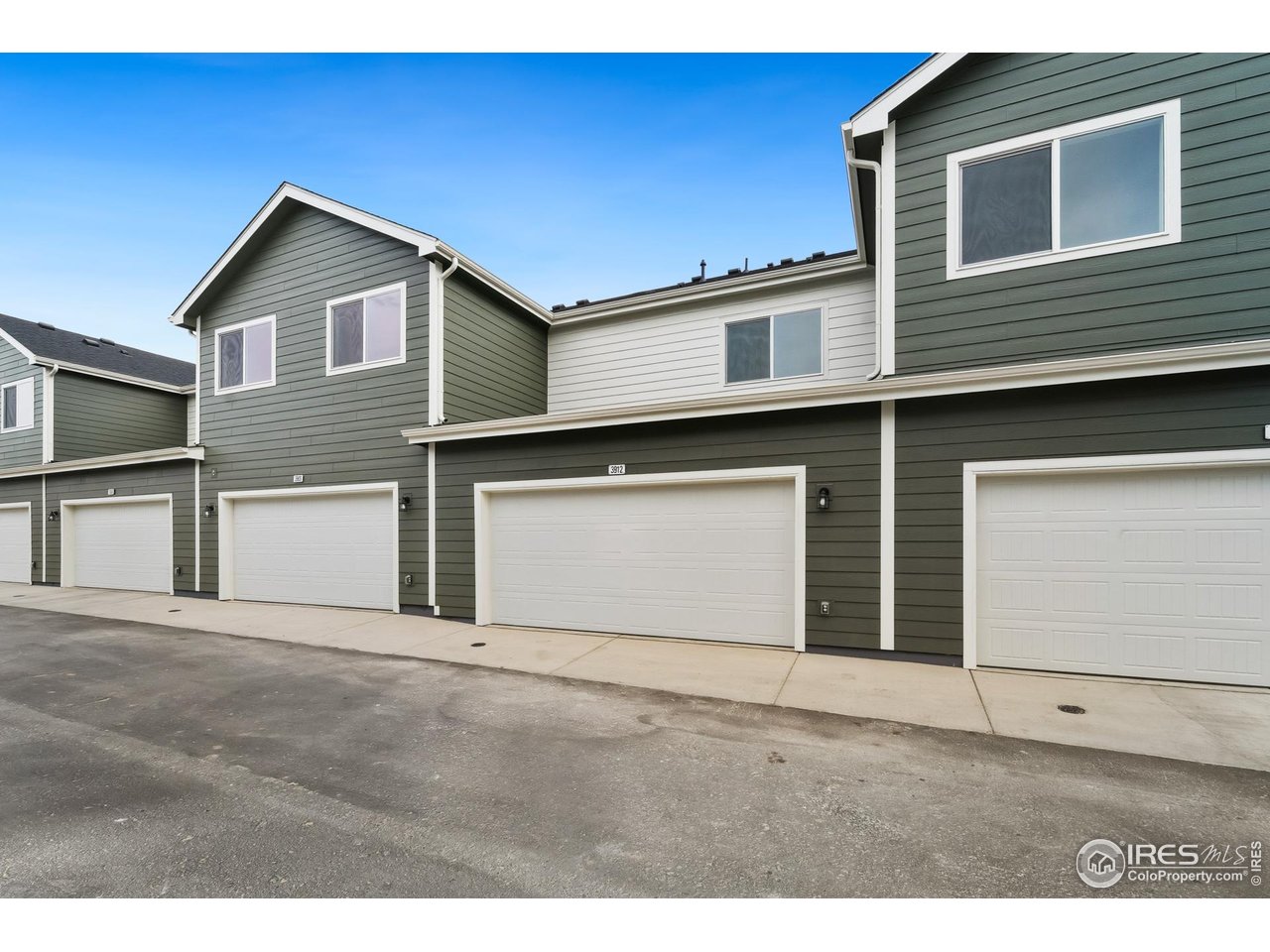3912 Net Street Evans, CO 80620 - Photo 13 of 19 a front view of a house with a garage