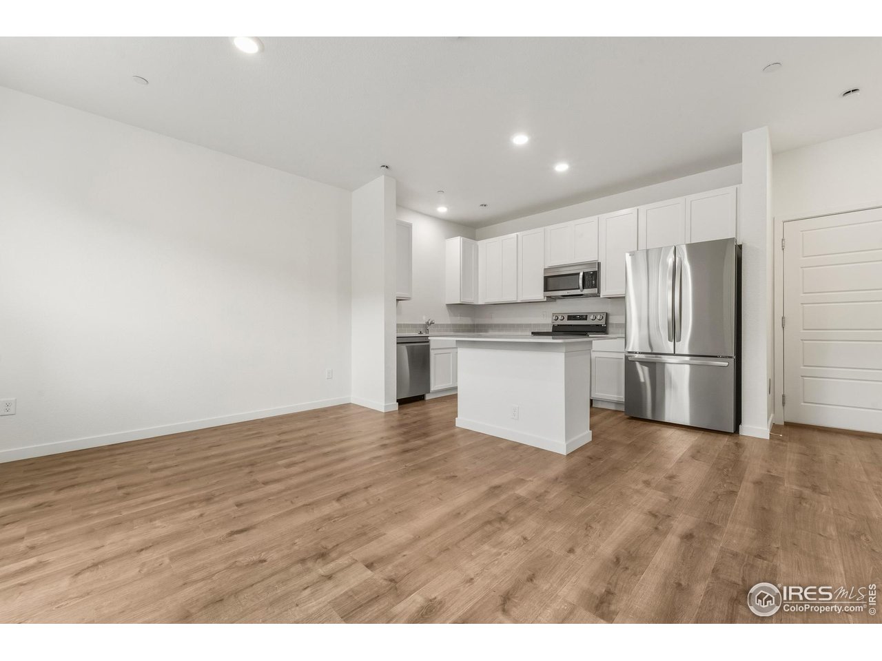 3912 Net Street Evans, CO 80620 - Photo 3 of 19 a view of kitchen with wooden floor
