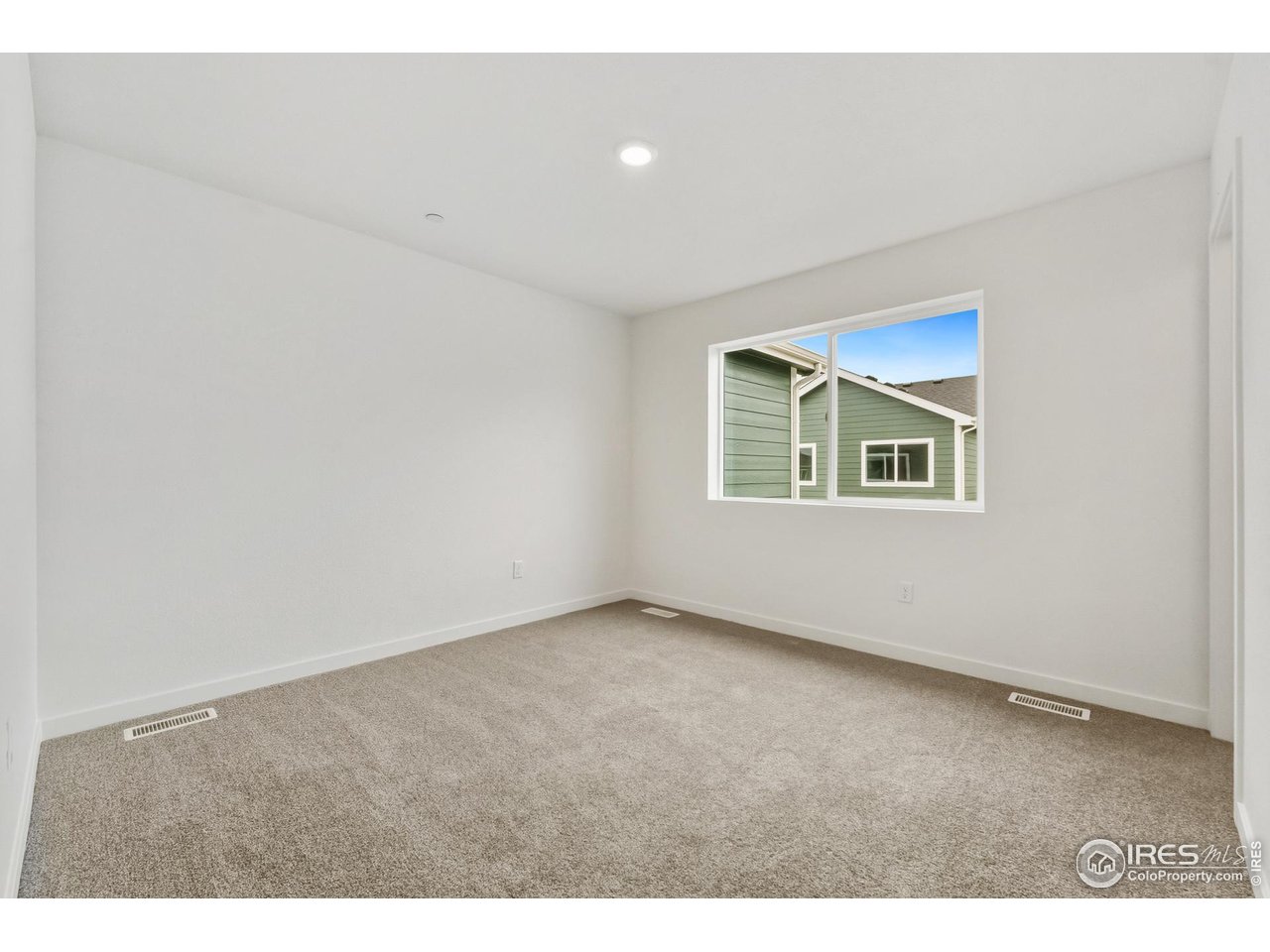 3912 Net Street Evans, CO 80620 - Photo 9 of 19 an empty room with windows and closet