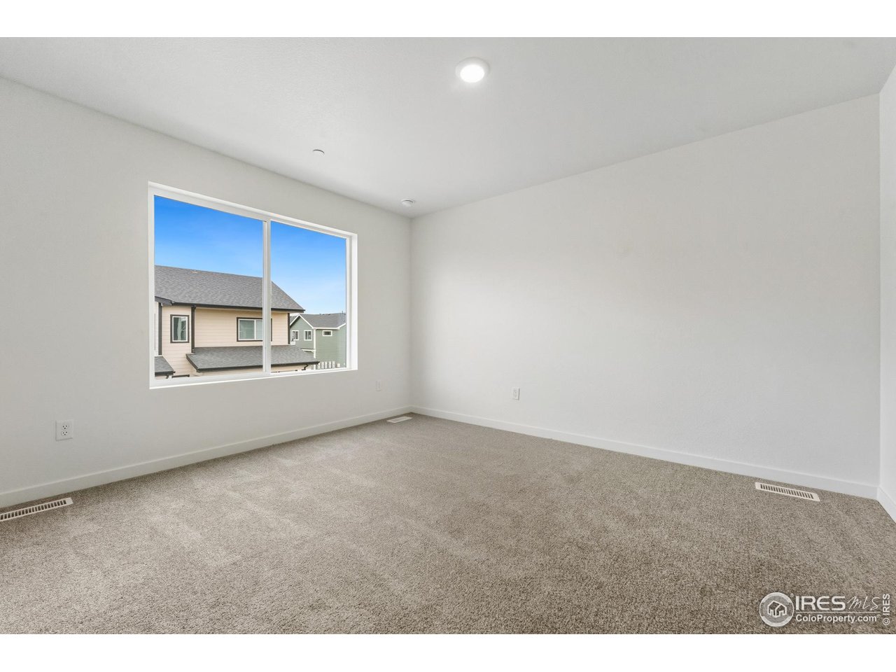 3912 Net Street Evans, CO 80620 - Photo 10 of 19 a view of an empty room with a window
