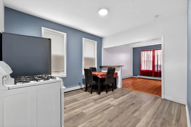 a dining room with furniture and window