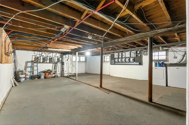 a view of empty room with wooden ceiling