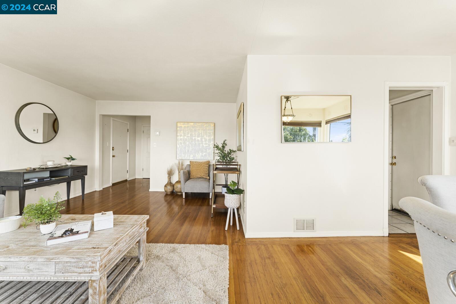 Undisclosed Address Richmond, CA 94805 - Photo 11 of 47 a living room with furniture and wooden floor