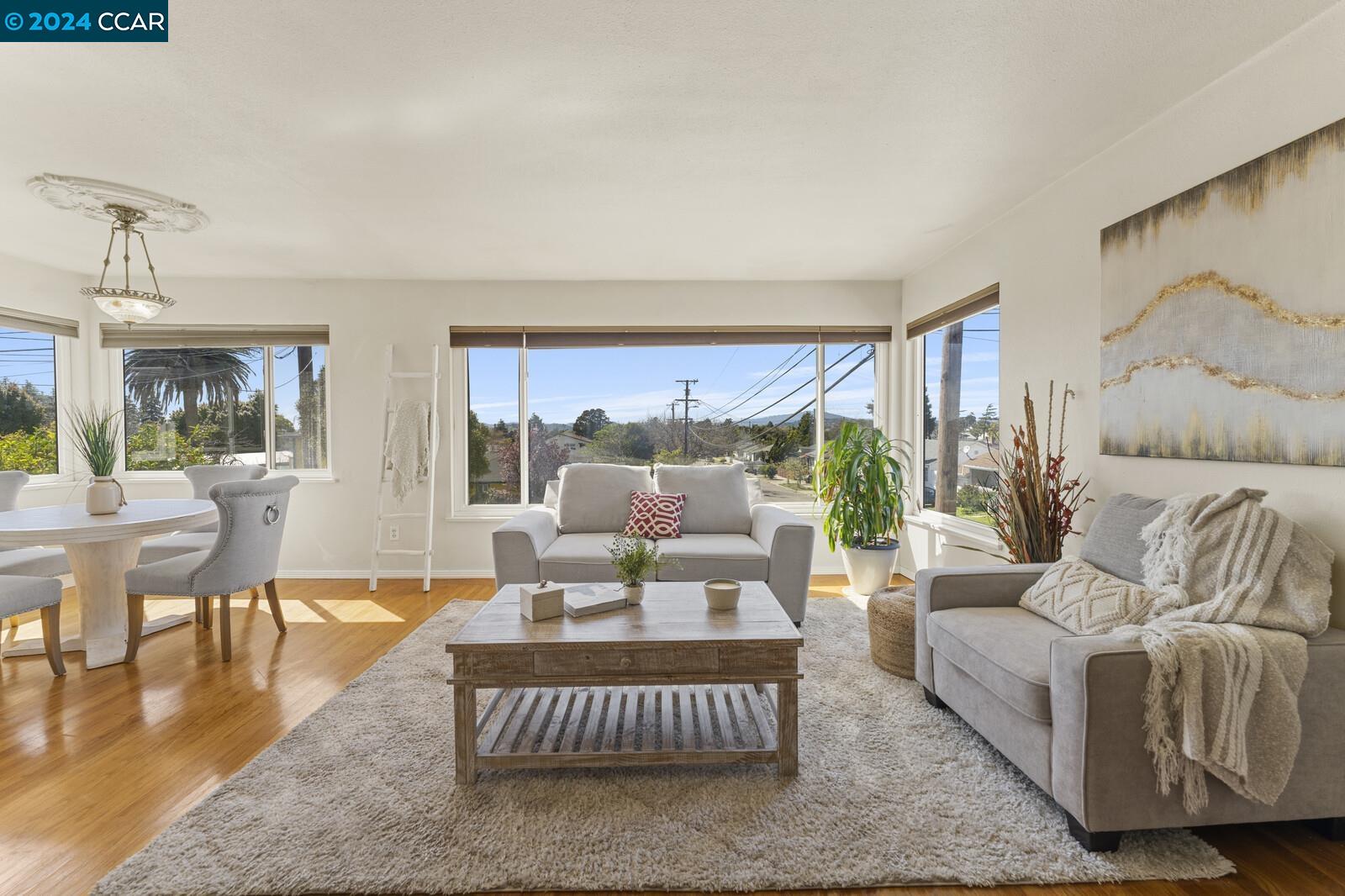 Undisclosed Address Richmond, CA 94805 - Photo 12 of 47 a living room with furniture and a large window