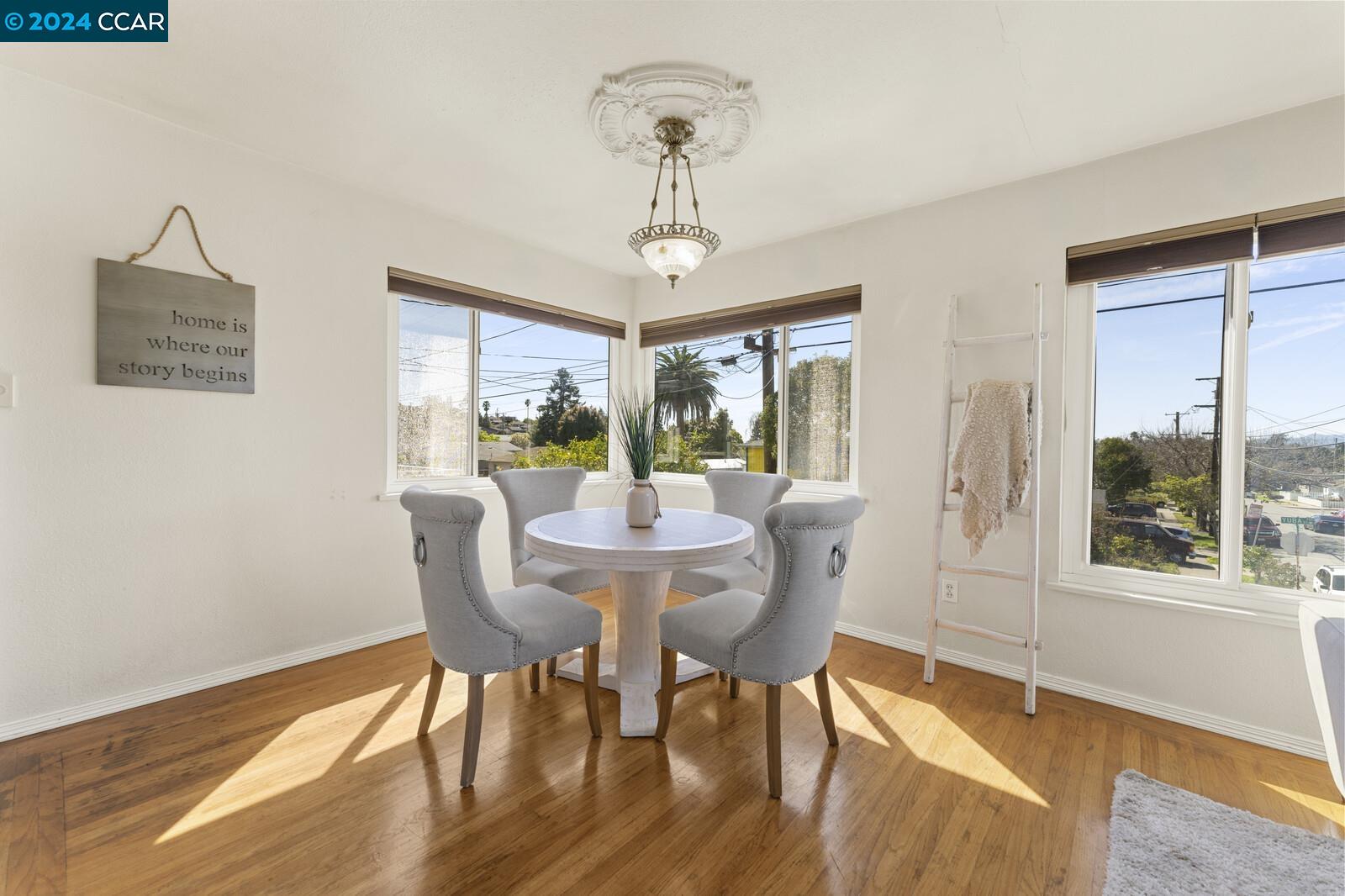 Undisclosed Address Richmond, CA 94805 - Photo 17 of 47 a view of a dining room with furniture window and wooden floor