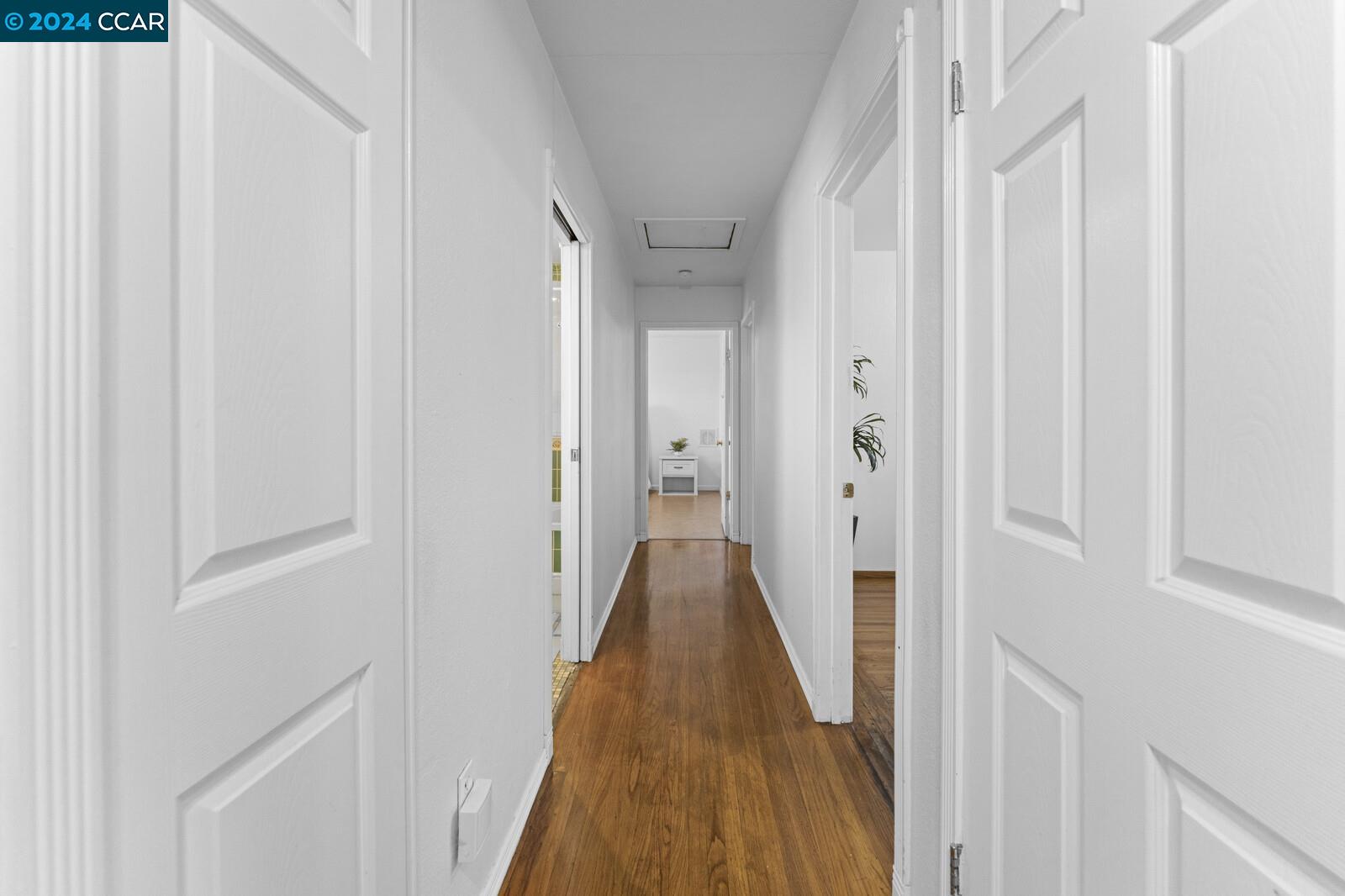 Undisclosed Address Richmond, CA 94805 - Photo 20 of 47 a view of a hallway with wooden floor and entryway