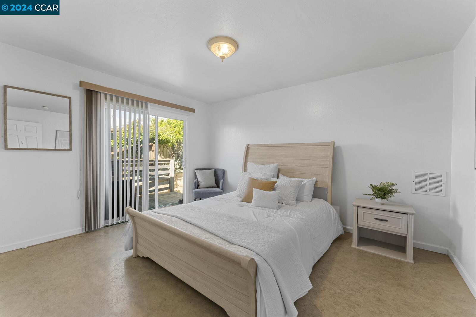 Undisclosed Address Richmond, CA 94805 - Photo 21 of 47 a bedroom with a bed and a window