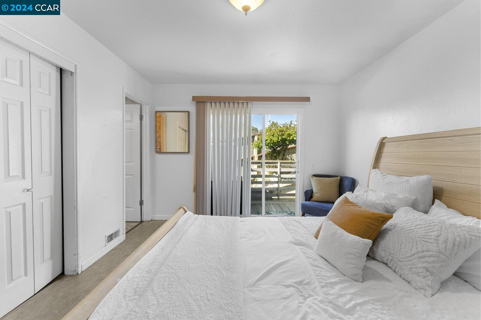 Undisclosed Address Richmond, CA 94805 - Photo 22 of 47 a bedroom with a bed and a window