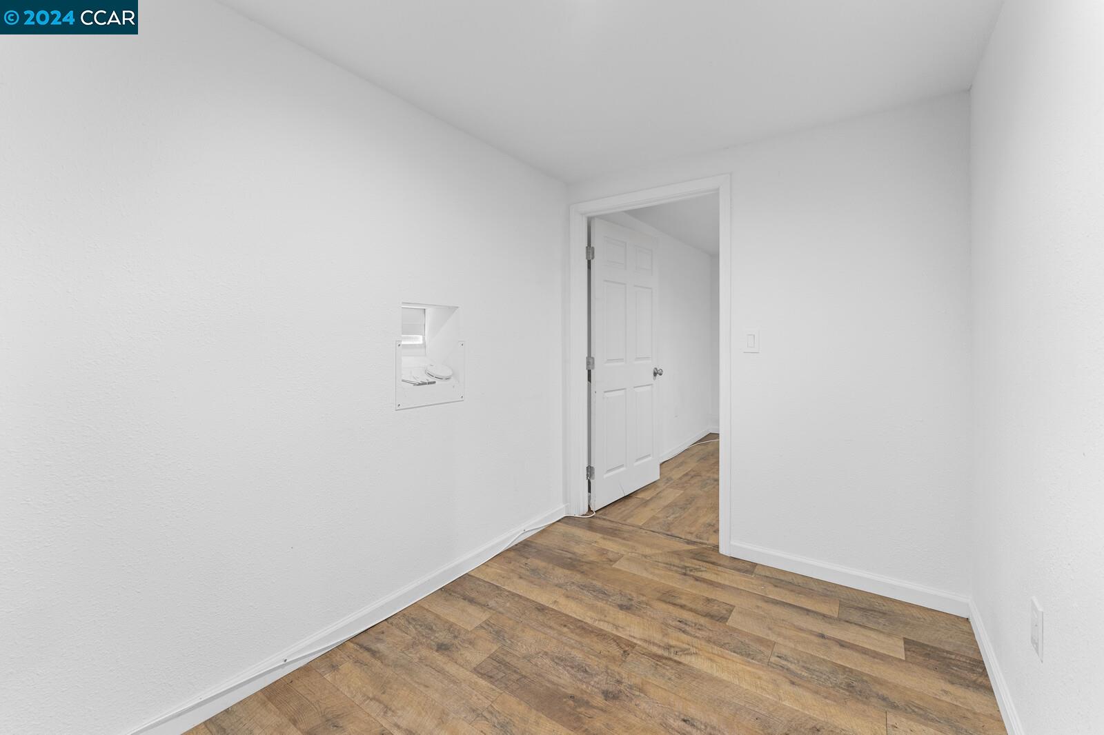 Undisclosed Address Richmond, CA 94805 - Photo 33 of 47 a view of a room with wooden floor