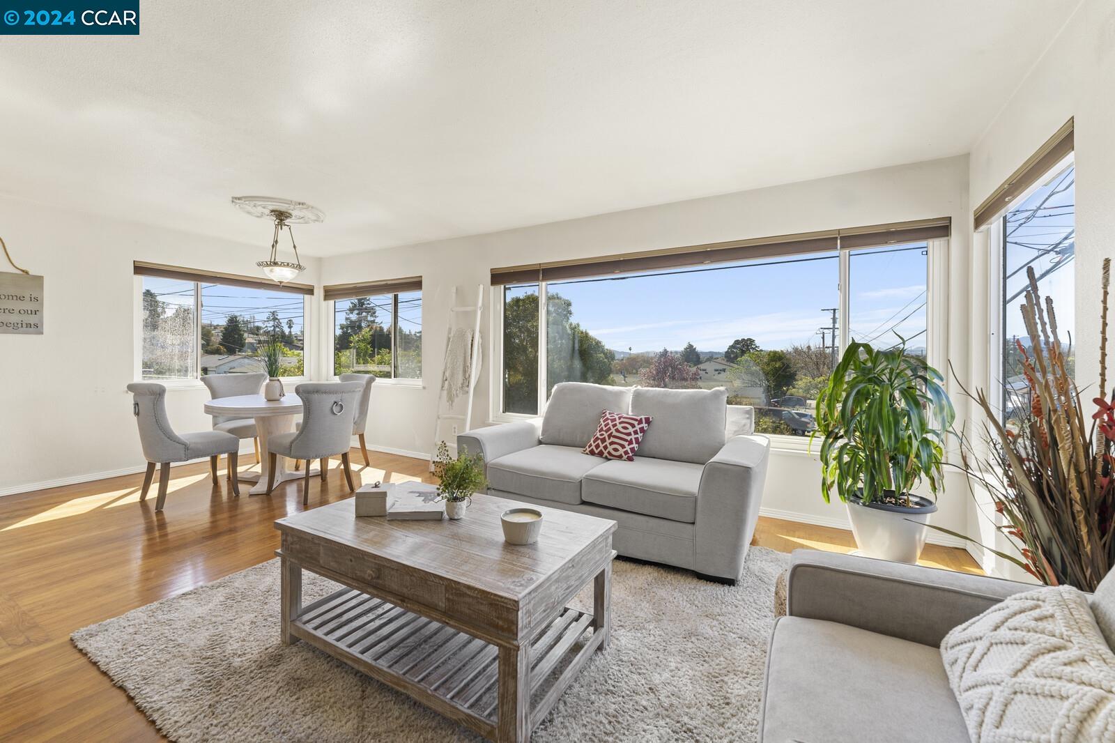 Undisclosed Address Richmond, CA 94805 - Photo 7 of 47 a living room with furniture and a large window