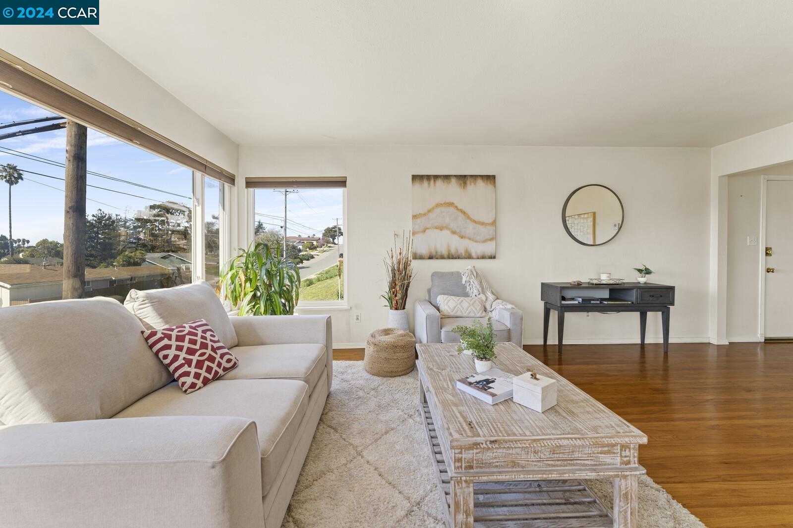 Undisclosed Address Richmond, CA 94805 - Photo 8 of 47 a living room with furniture and a large window