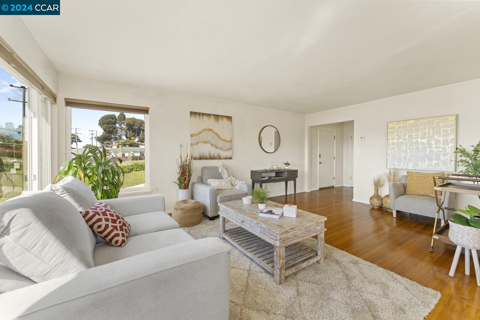 Undisclosed Address Richmond, CA 94805 - Photo 9 of 47 a living room with furniture and a large window