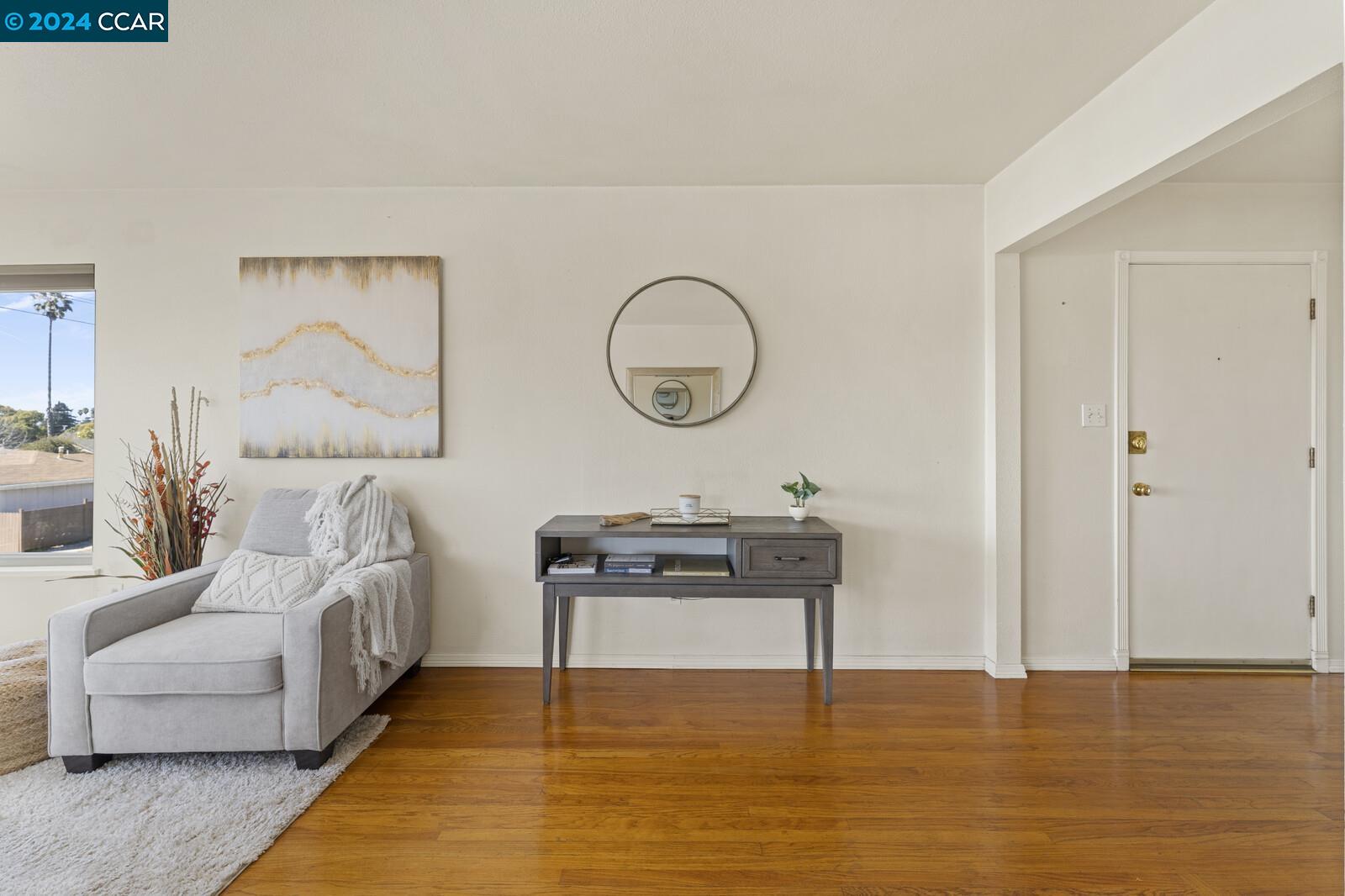 Undisclosed Address Richmond, CA 94805 - Photo 10 of 47 a living room with furniture and a floor to ceiling window