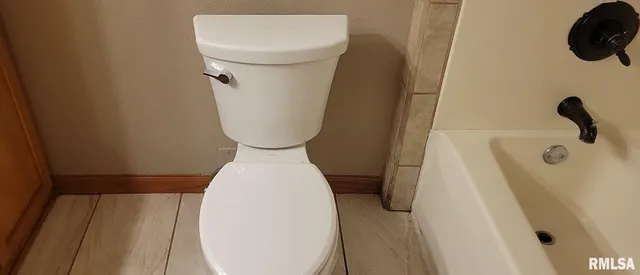 a close view of a sink in back of a bathroom