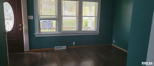 a view of a room that has a window in it