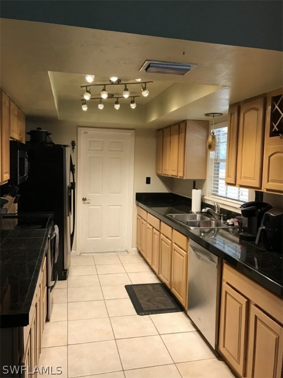 9104 Temple Road West Fort Myers, FL 33967 - Photo 3 of 12 a kitchen with stainless steel appliances granite countertop a refrigerator and a sink