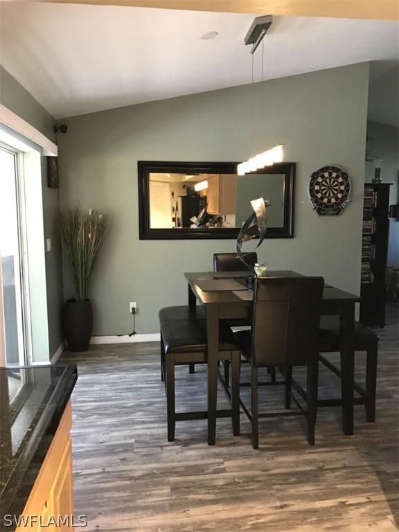 9104 Temple Road West Fort Myers, FL 33967 - Photo 4 of 12 a view of a dining room with furniture and wooden floor