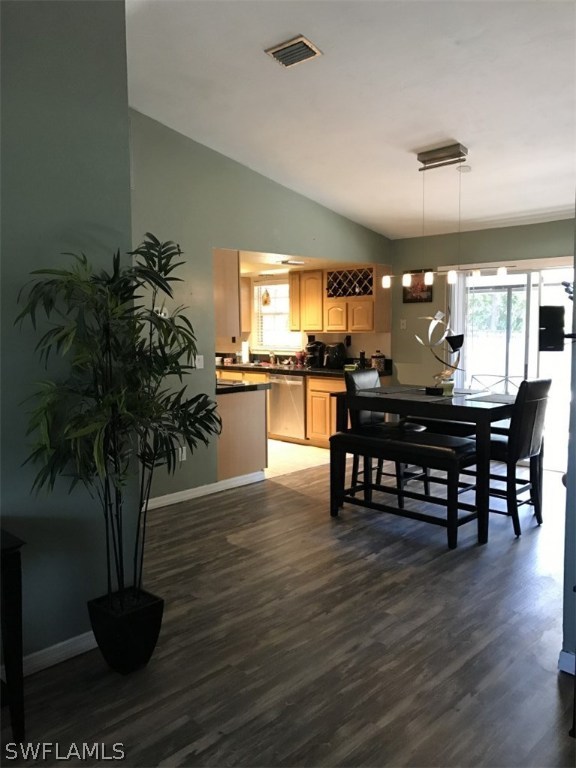 9104 Temple Road West Fort Myers, FL 33967 - Photo 5 of 12 a dining room with furniture and wooden floor