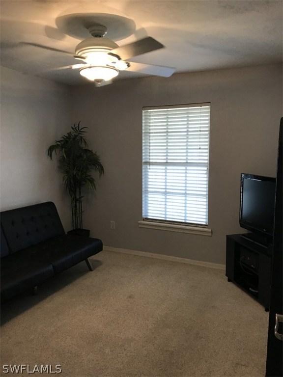 9104 Temple Road West Fort Myers, FL 33967 - Photo 8 of 12 a living room with furniture and a flat screen tv