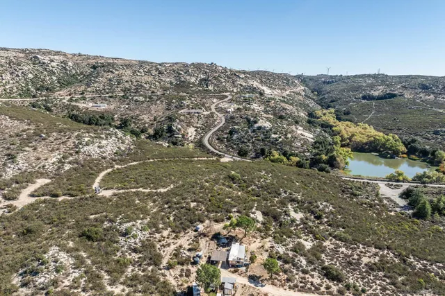 an aerial view of mountain with lake view