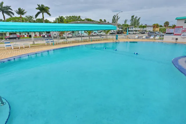 a view of a swimming pool with outdoor seating and outdoor view