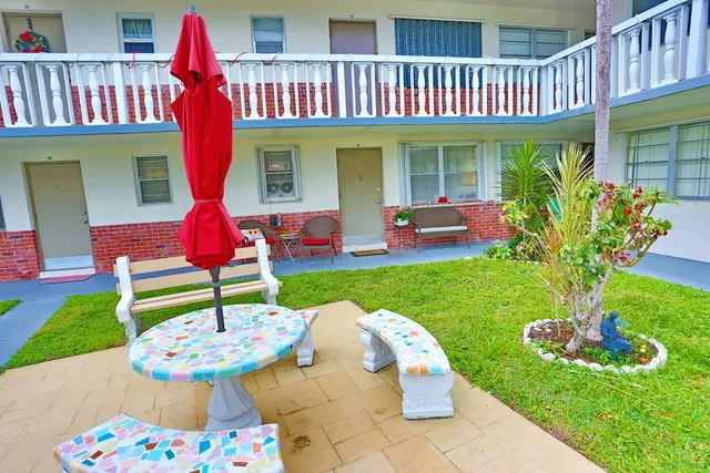 a backyard of a house with seating space