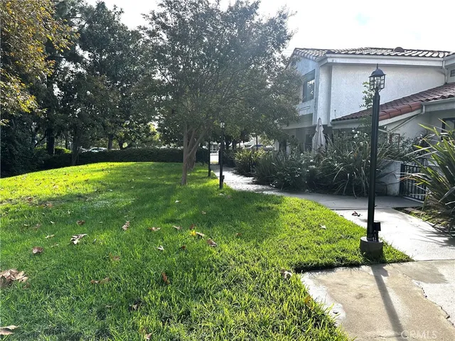 a backyard of a house with lots of green space
