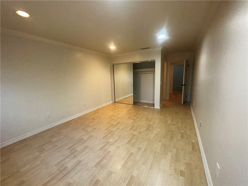 9356 19th Street, Unit D Rancho Cucamonga, CA 91701 - Photo 10 of 16 wooden floor in an empty room