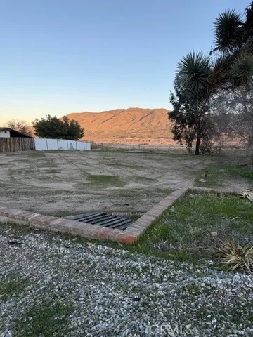 a view of a yard with an ocean view