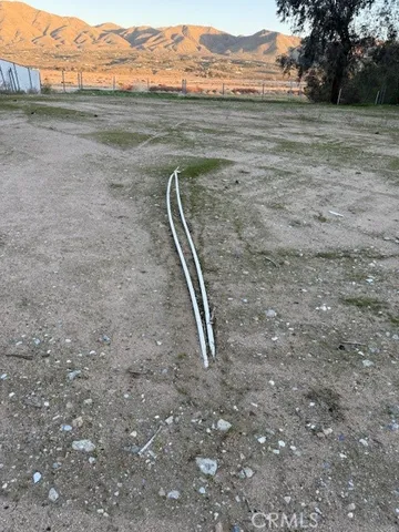 a view of a field with an ocean beach