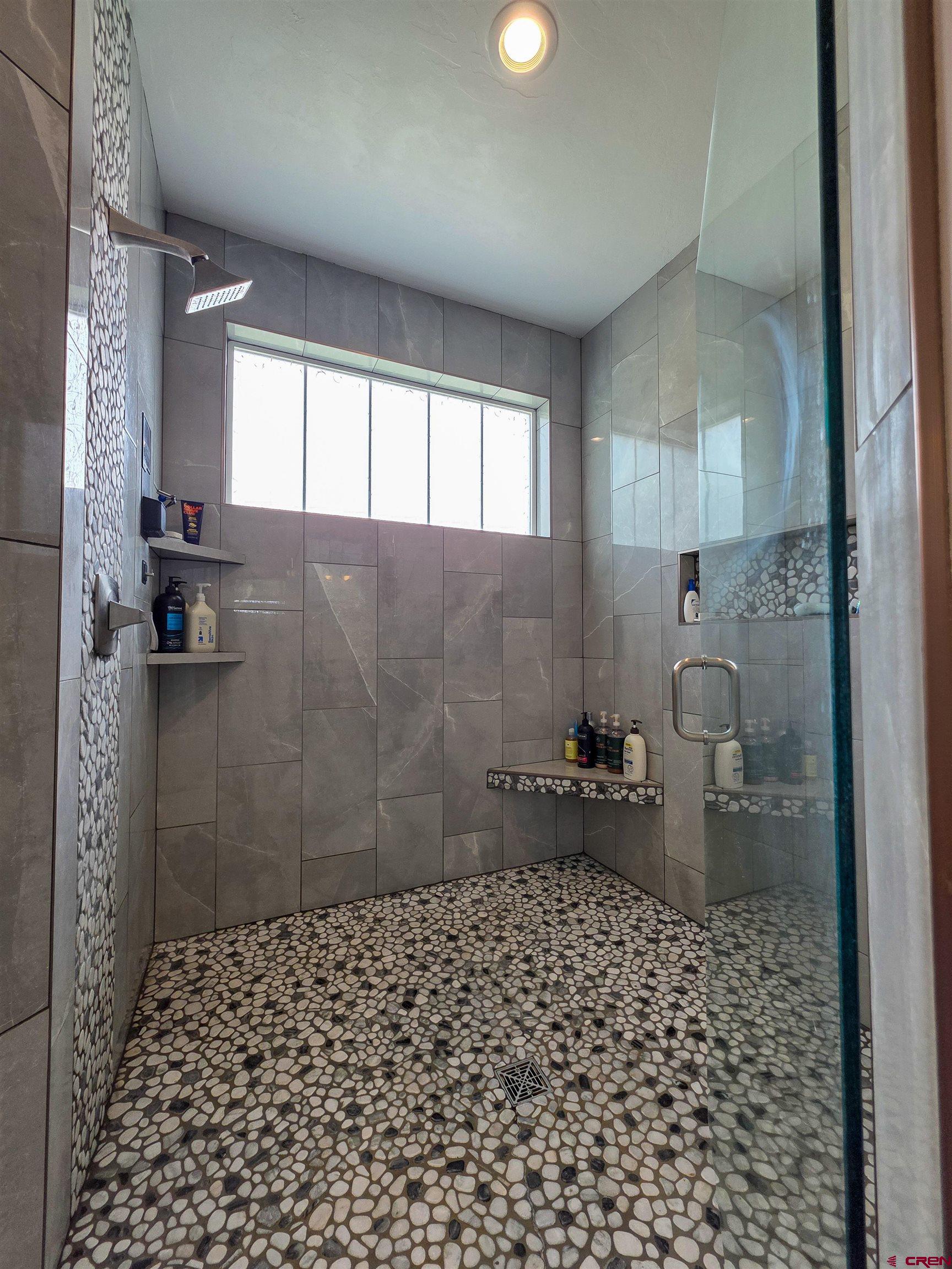1771 Trappers Court Delta, CO 81416 - Photo 14 of 44 a bathroom with a sink a toilet and shower