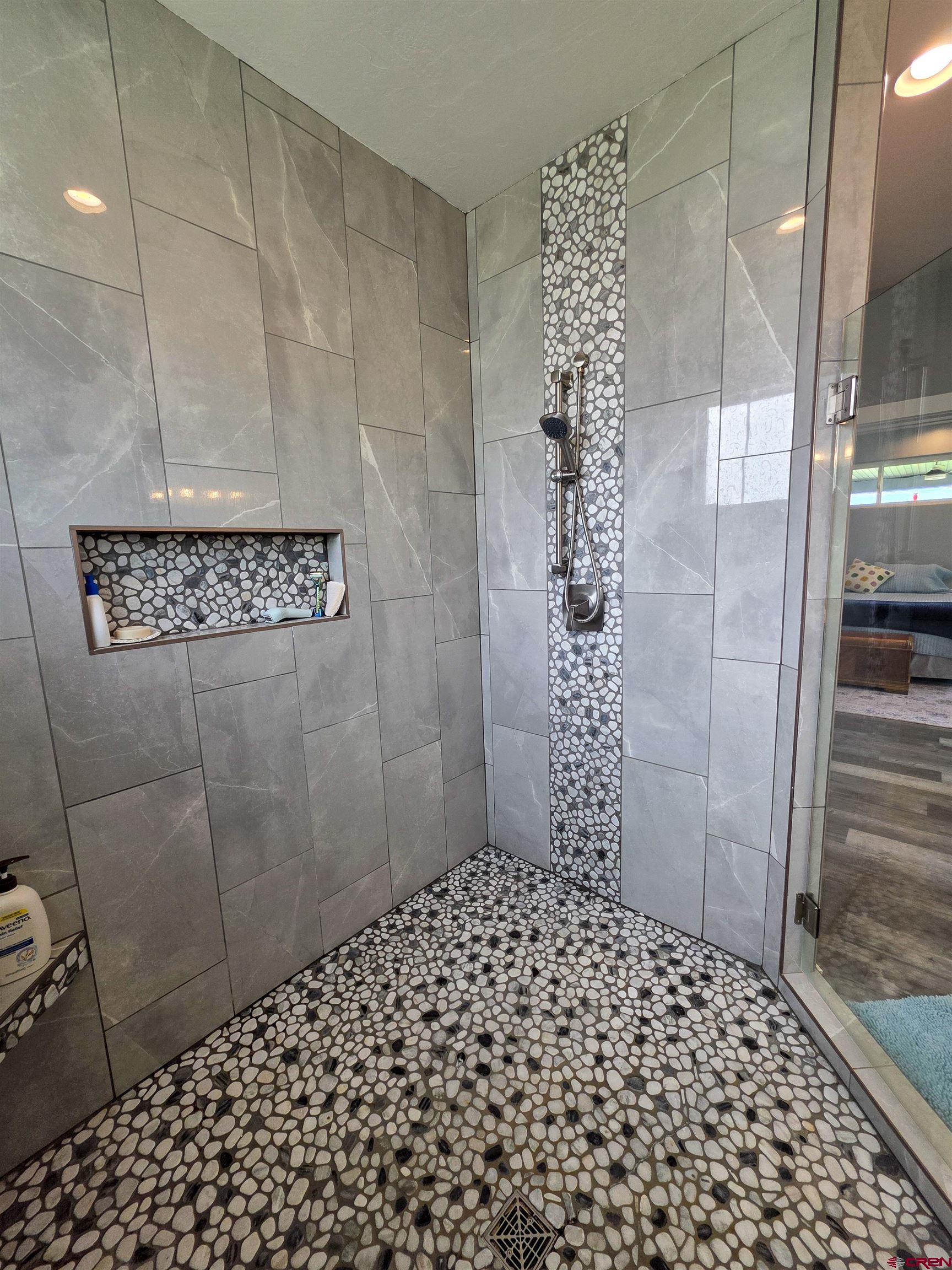 1771 Trappers Court Delta, CO 81416 - Photo 15 of 44 a bathroom with a shower