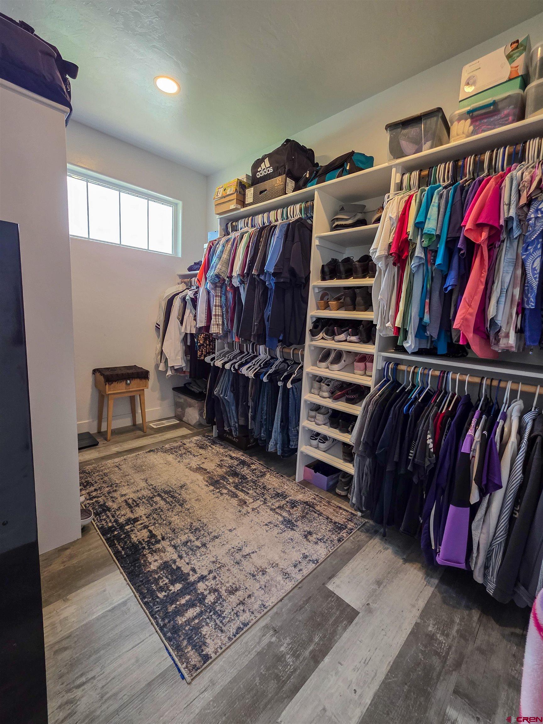 1771 Trappers Court Delta, CO 81416 - Photo 16 of 44 a view of walk in closet with clothes and shoes