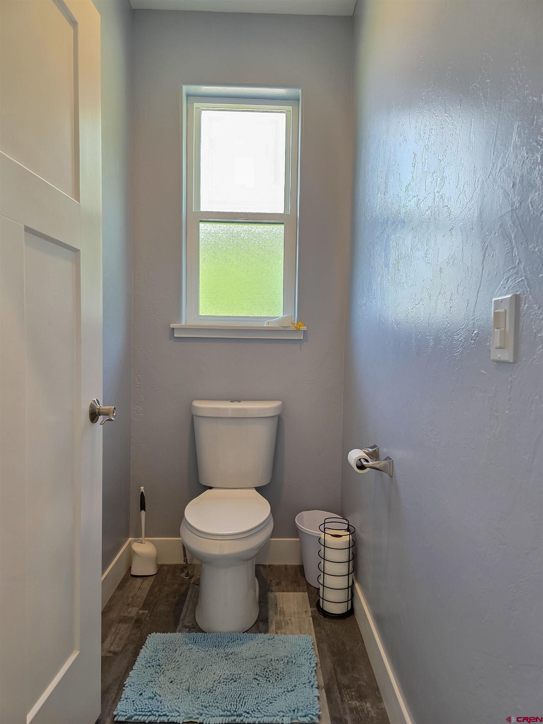 1771 Trappers Court Delta, CO 81416 - Photo 17 of 44 a bathroom with a toilet and a window