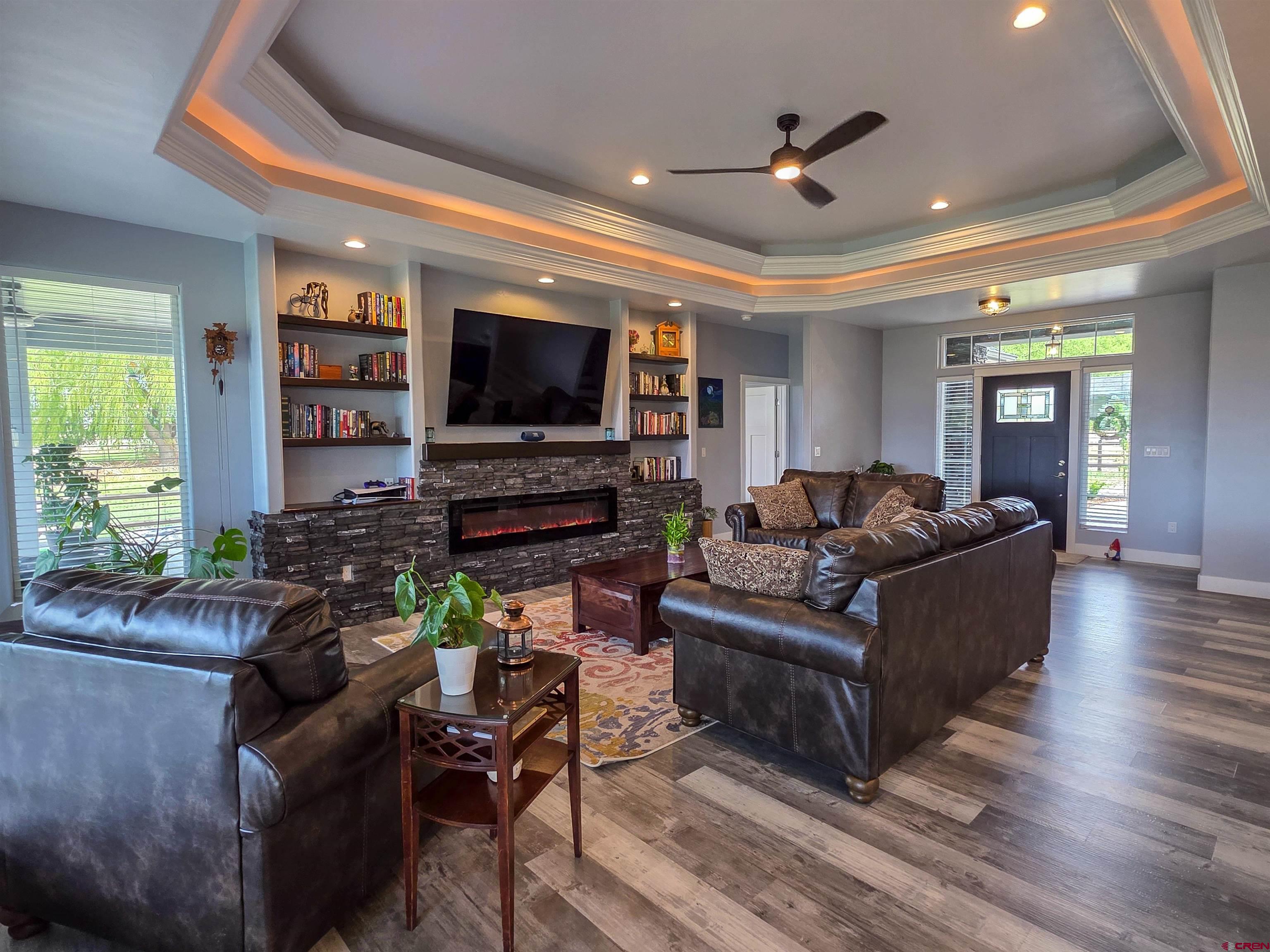 1771 Trappers Court Delta, CO 81416 - Photo 2 of 44 a living room with furniture and a flat screen tv