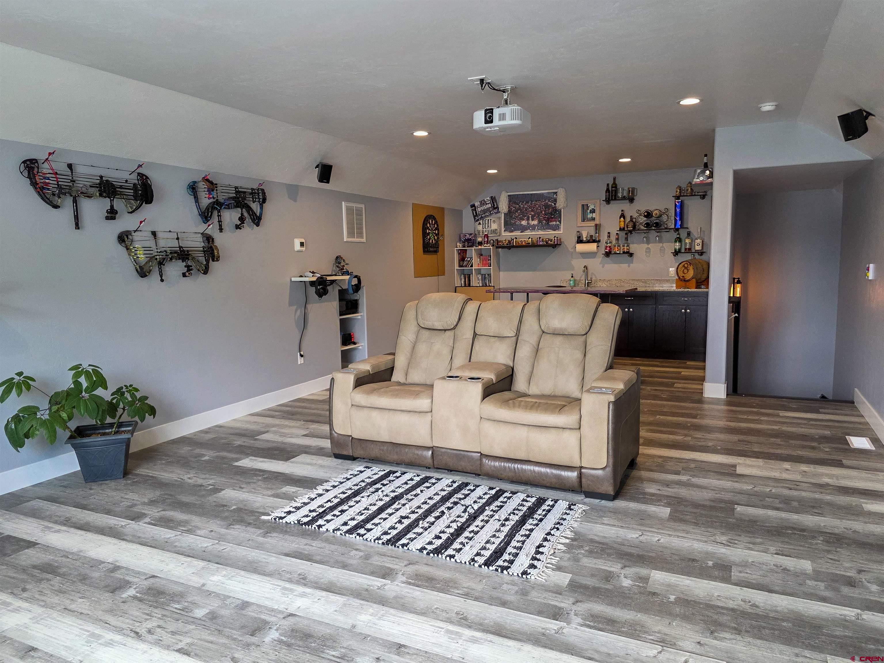 1771 Trappers Court Delta, CO 81416 - Photo 21 of 44 a living room with furniture and a potted plant