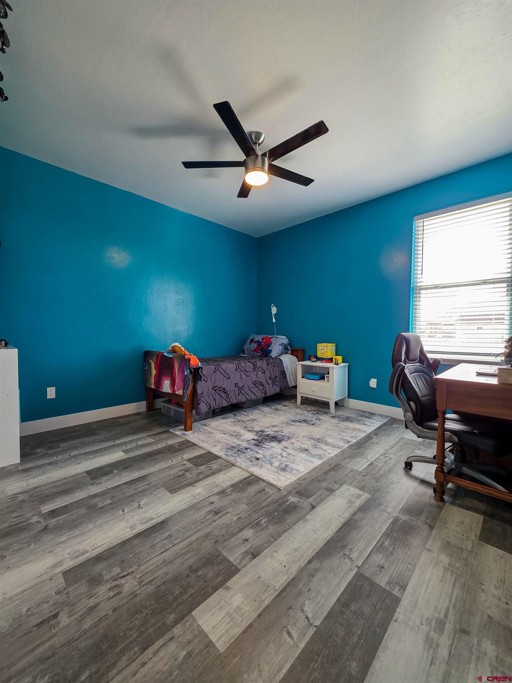 1771 Trappers Court Delta, CO 81416 - Photo 26 of 44 a bedroom with bed and a window