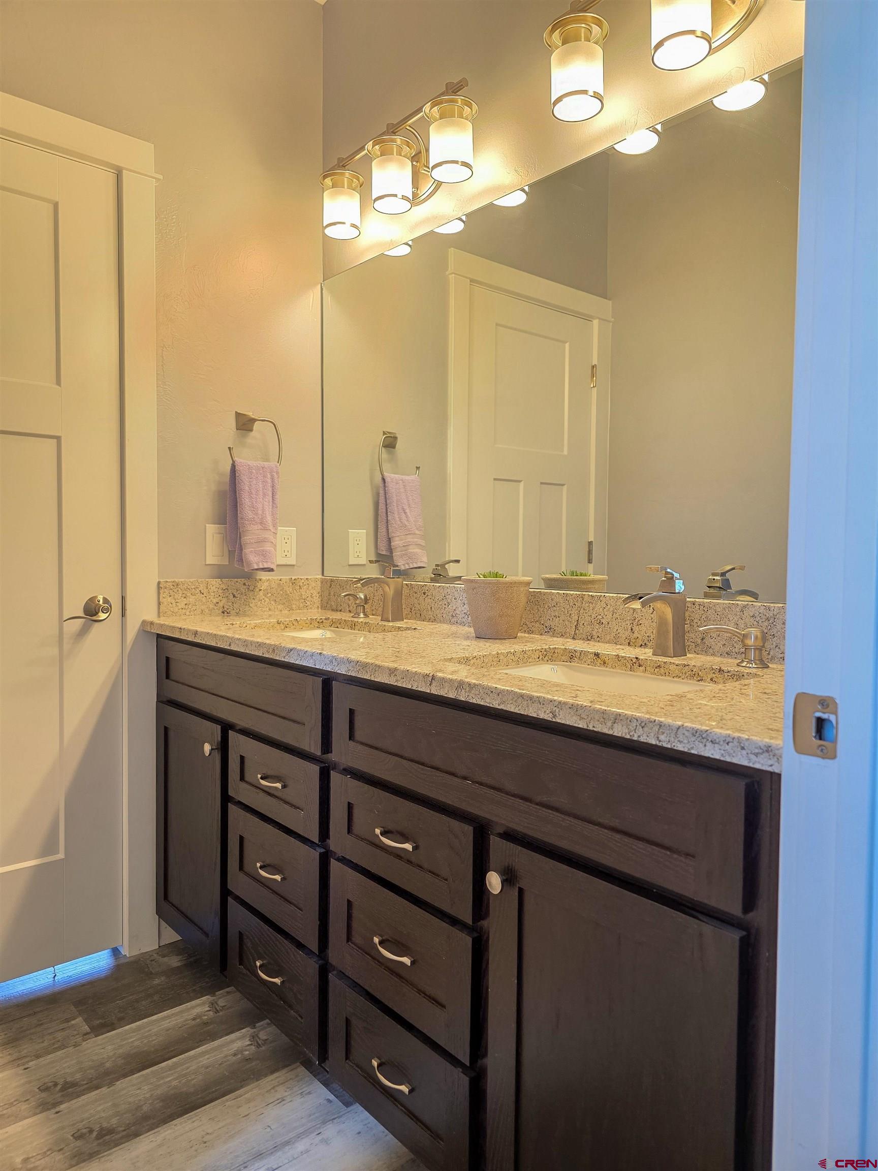 1771 Trappers Court Delta, CO 81416 - Photo 28 of 44 a bathroom with a granite countertop sink and a mirror