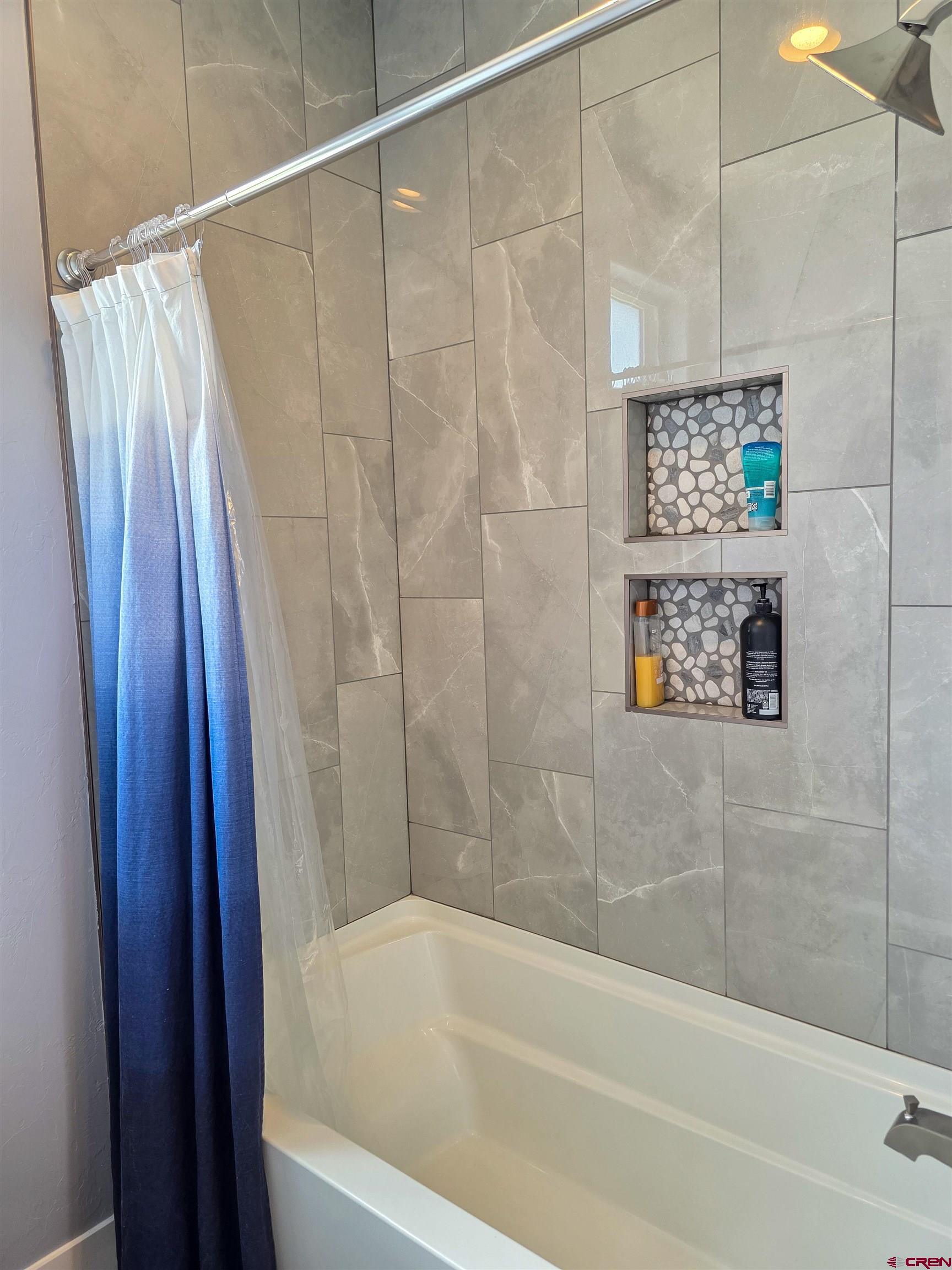 1771 Trappers Court Delta, CO 81416 - Photo 29 of 44 a bathroom with a shower and a bath tub