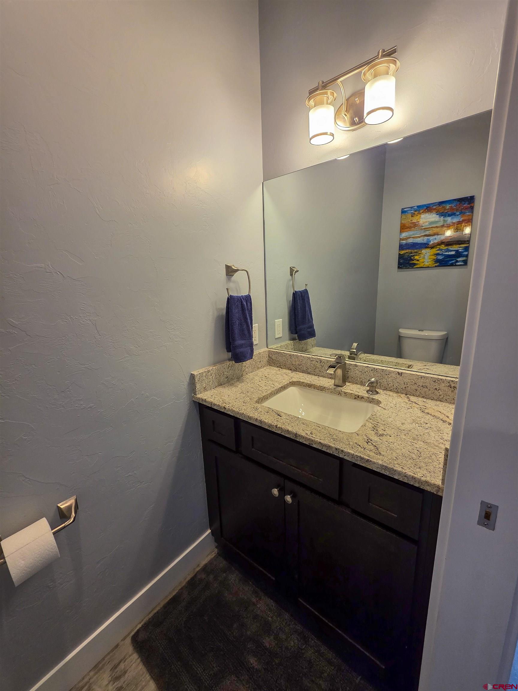 1771 Trappers Court Delta, CO 81416 - Photo 30 of 44 a bathroom with a granite countertop sink and a mirror