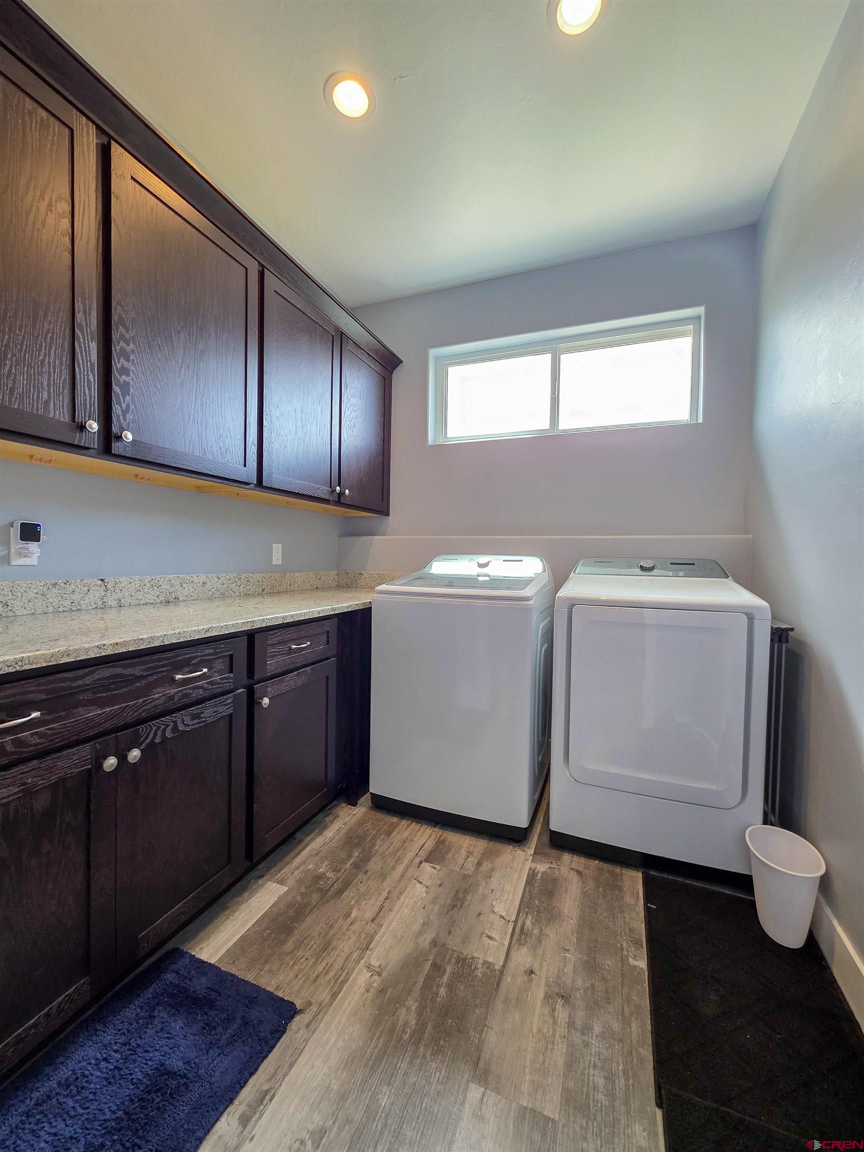 1771 Trappers Court Delta, CO 81416 - Photo 32 of 44 a kitchen with a sink and wooden cabinets