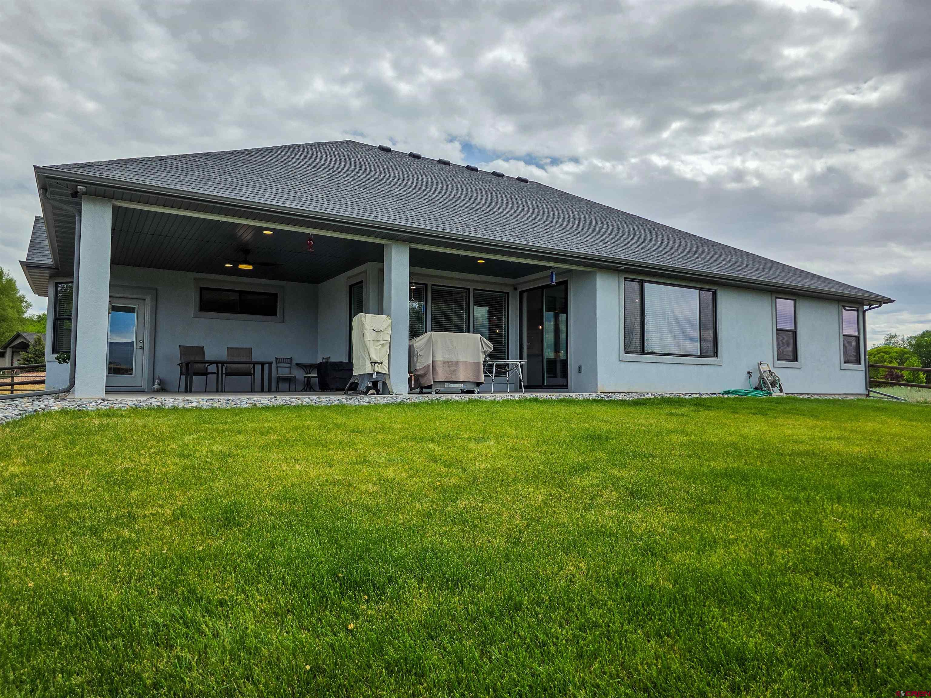 1771 Trappers Court Delta, CO 81416 - Photo 42 of 44 a front view of house with yard and porch
