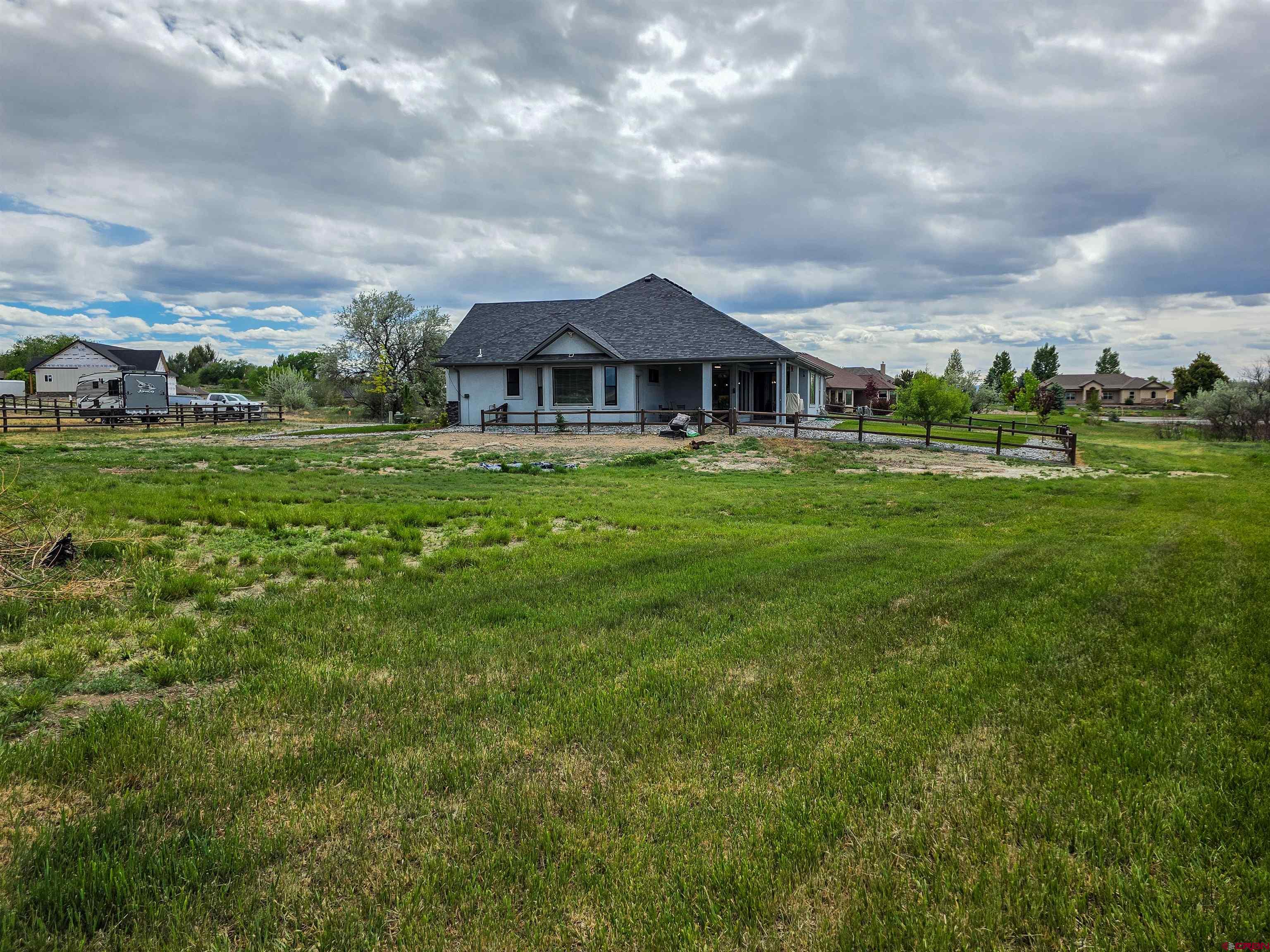 1771 Trappers Court Delta, CO 81416 - Photo 44 of 44 a view of a big yard with plants and large trees