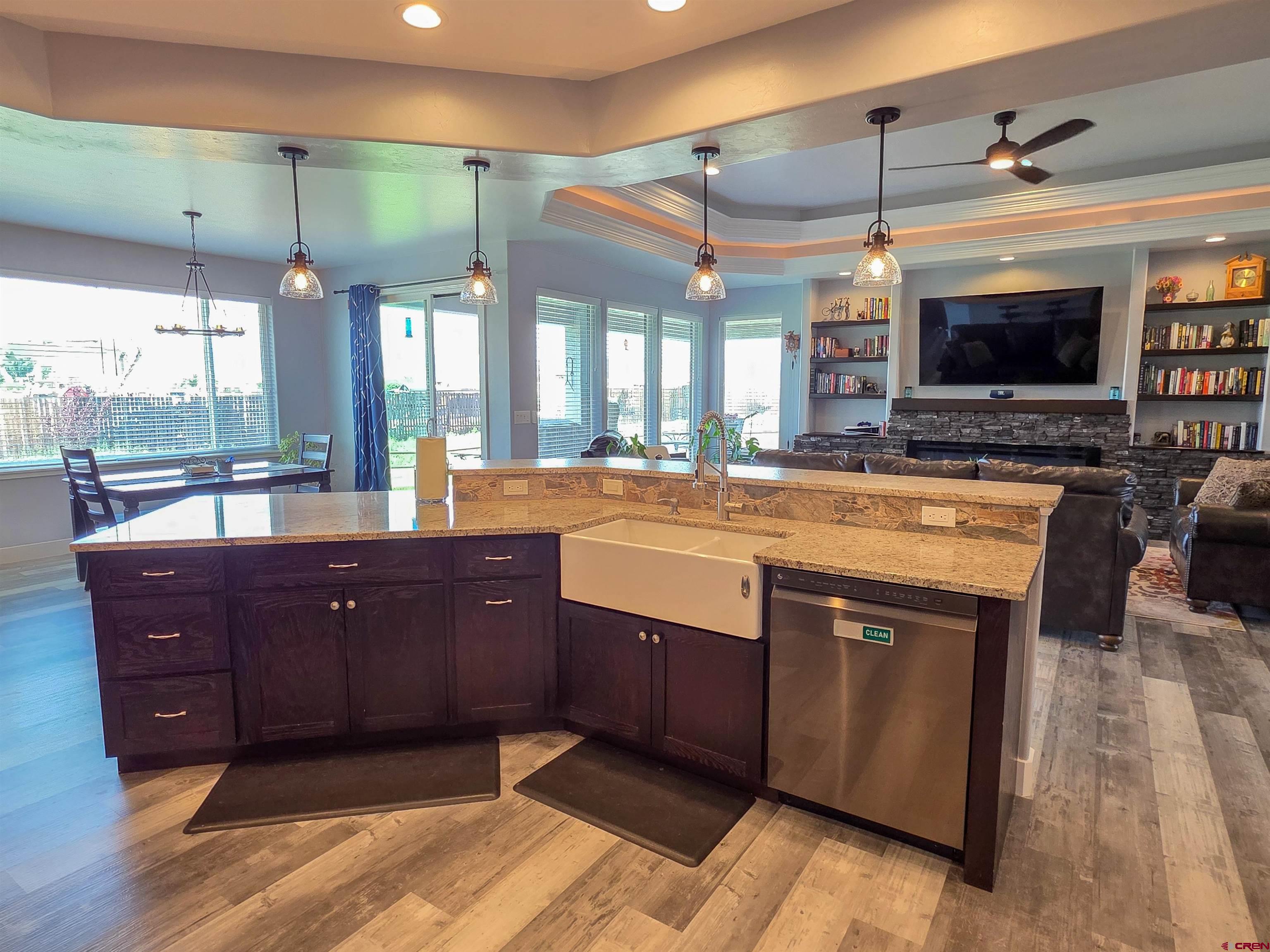 1771 Trappers Court Delta, CO 81416 - Photo 9 of 44 a large kitchen with stainless steel appliances granite countertop a sink and a stove
