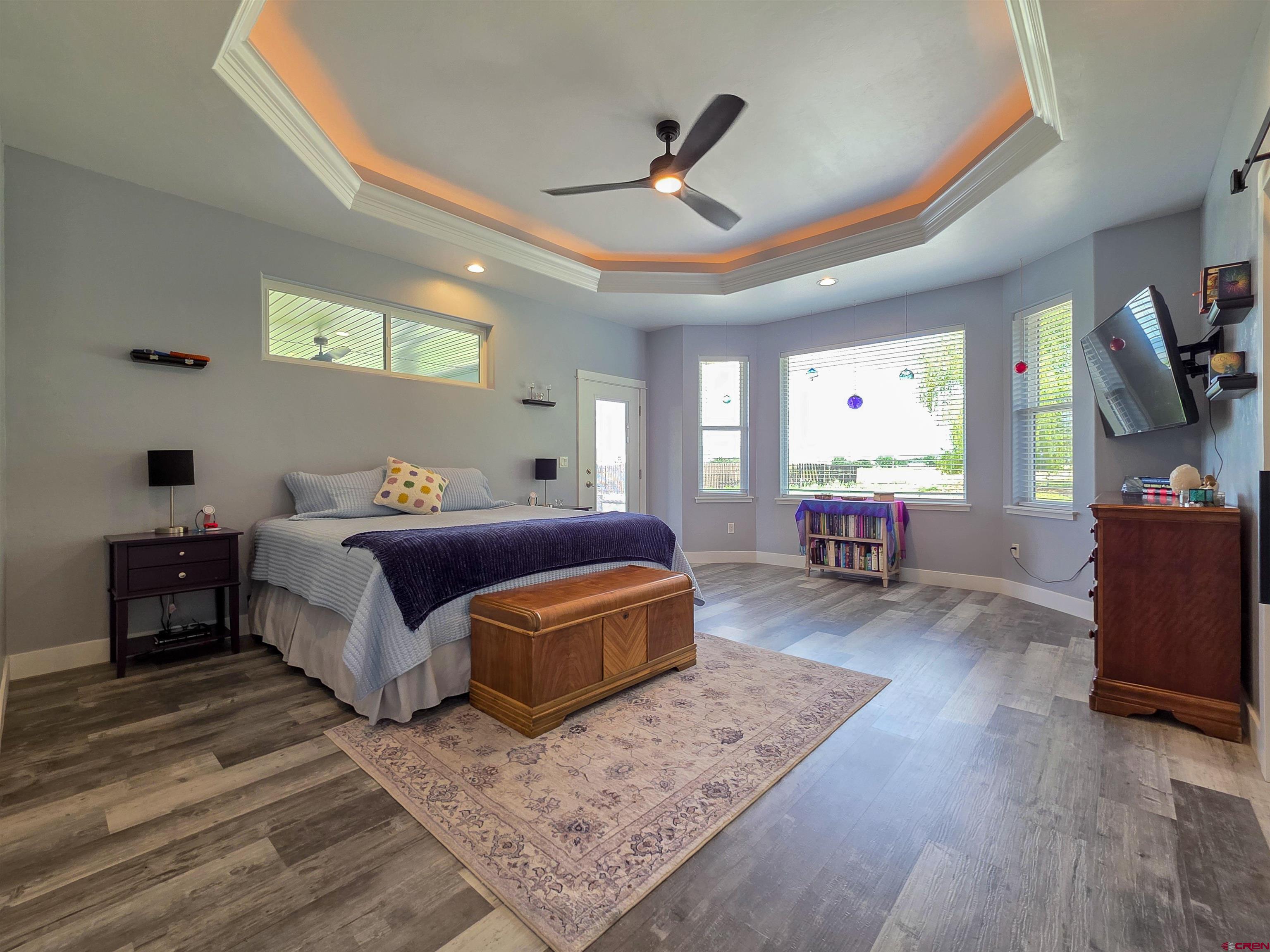 1771 Trappers Court Delta, CO 81416 - Photo 10 of 44 a spacious bedroom with a bed a window and dresser