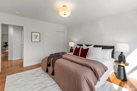 a bed room with a bed and a lamp