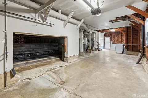 a view of a water heater room with a fireplace