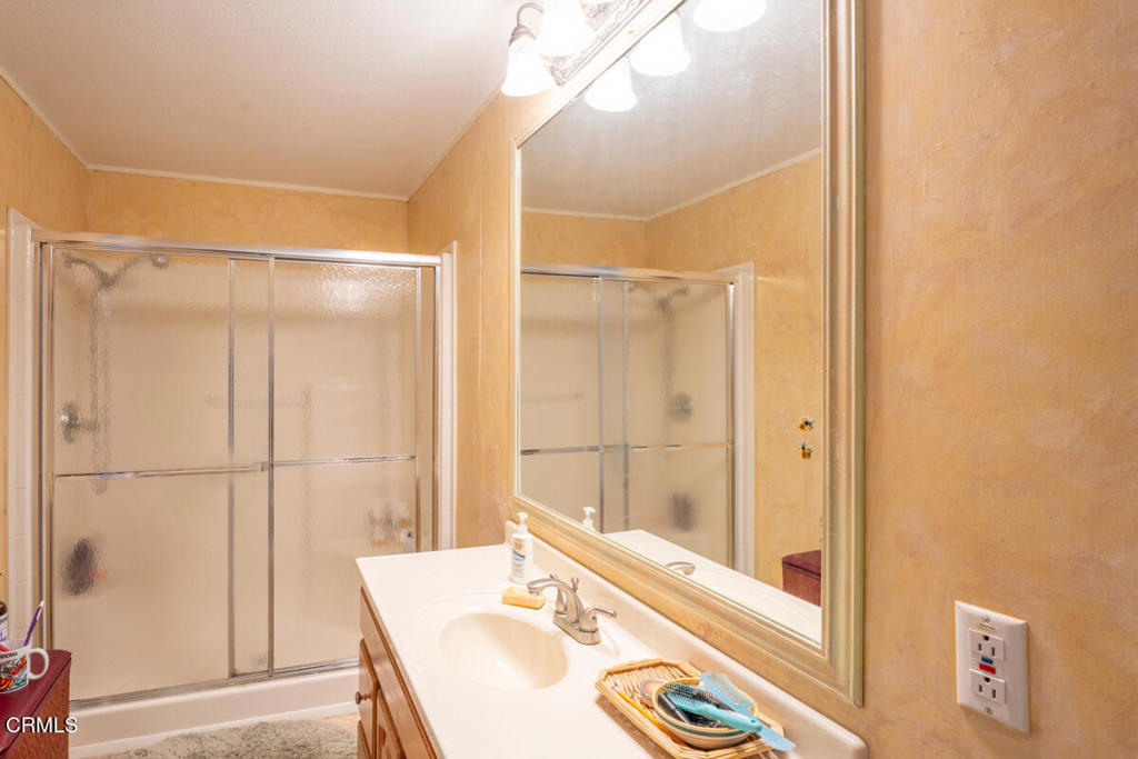 43300 Little River-Airport Road, Unit 90 Little River, CA 95456 - Photo 15 of 21 a bathroom with a sink and a large mirror